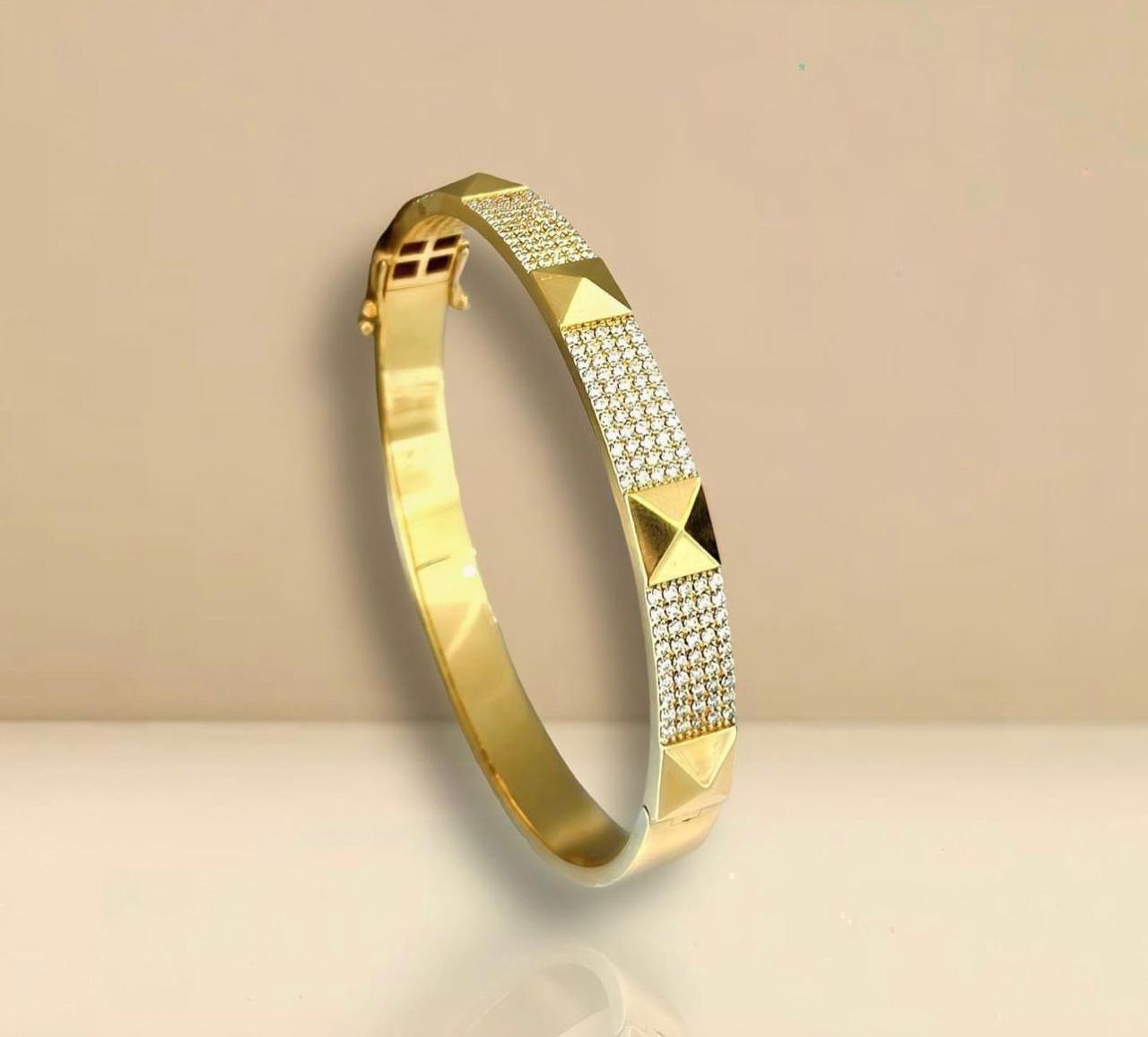 BRAZALETE DIAMANTE Y TACHAS 18K 11.1G